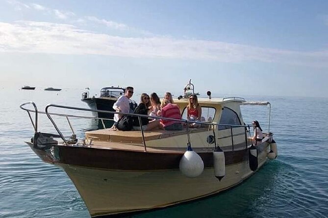 Capri Collective Boat Excursion from Positano - Swim breaks with towels and drinks: the practical highlight