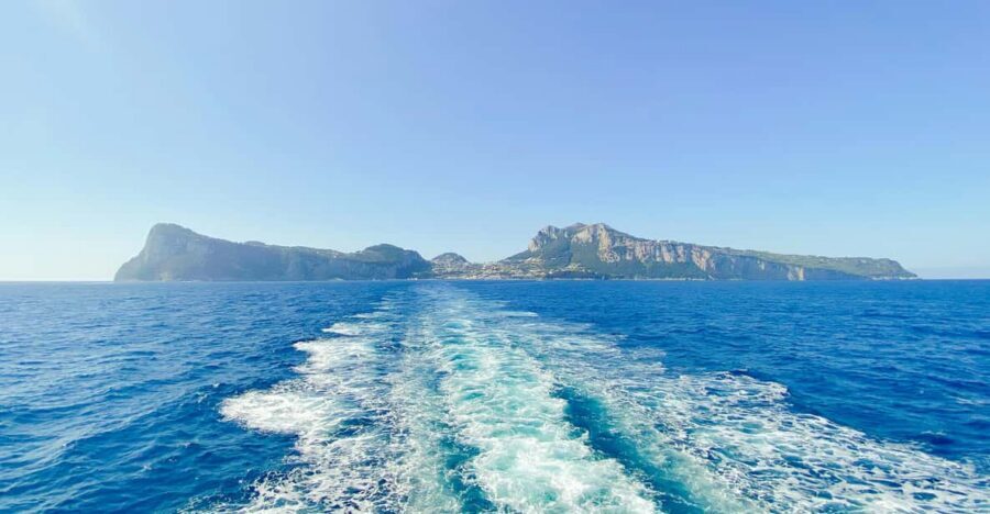 Positano: Capri and Blue Grotto Shared Boat Tour with Drinks - The “around Capri” boat loop: grottos, Faraglioni, and Punta Carena