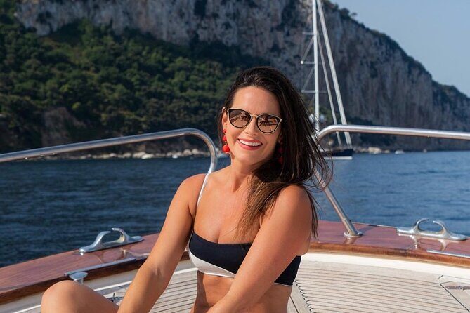 Positano , Praiano to Capri private boat tour - The Capri boat loop: grottos, Faraglioni, and Punta Carena views