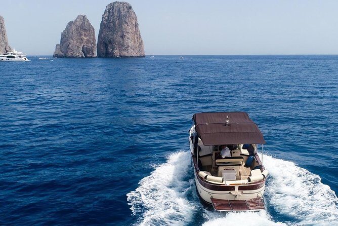 Private Scenic Boat Tour from Sorrento to Capri and Positano - Li Galli: sirens, crystal water, and a short admission-included stop