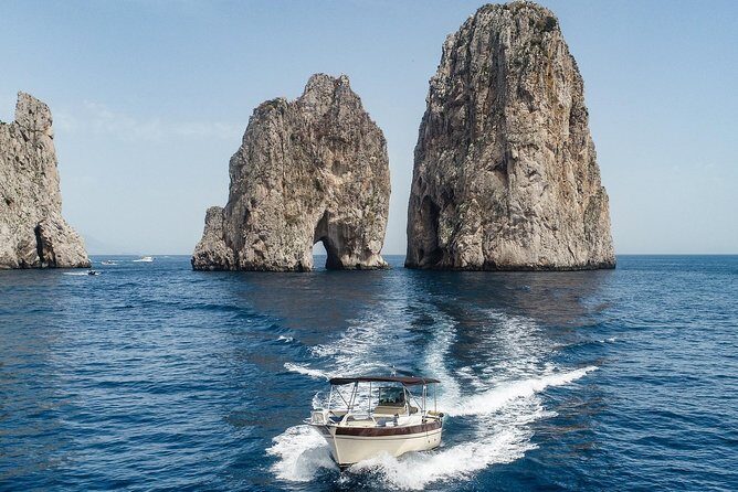 Private Scenic Boat Tour from Sorrento to Capri and Positano - Faraglioni and Punta Carena Lighthouse: the iconic rock view and a sunset-worthy symbol