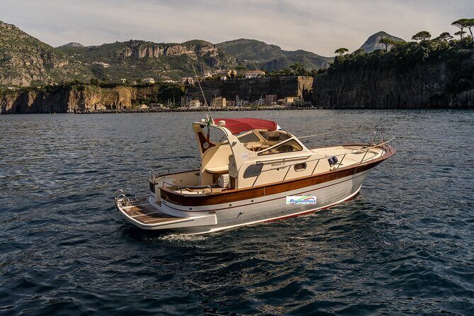 Private Tour to Capri & Positano from Sorrento Classic Gozzo 850 - Punta Carena to Marina Piccola: Lighthouse Views, Clear Water, and a Quick Natural Arch